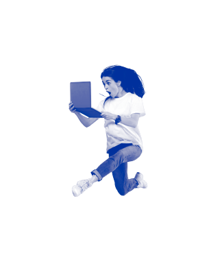 A woman jumping with joy holding her laptop. 