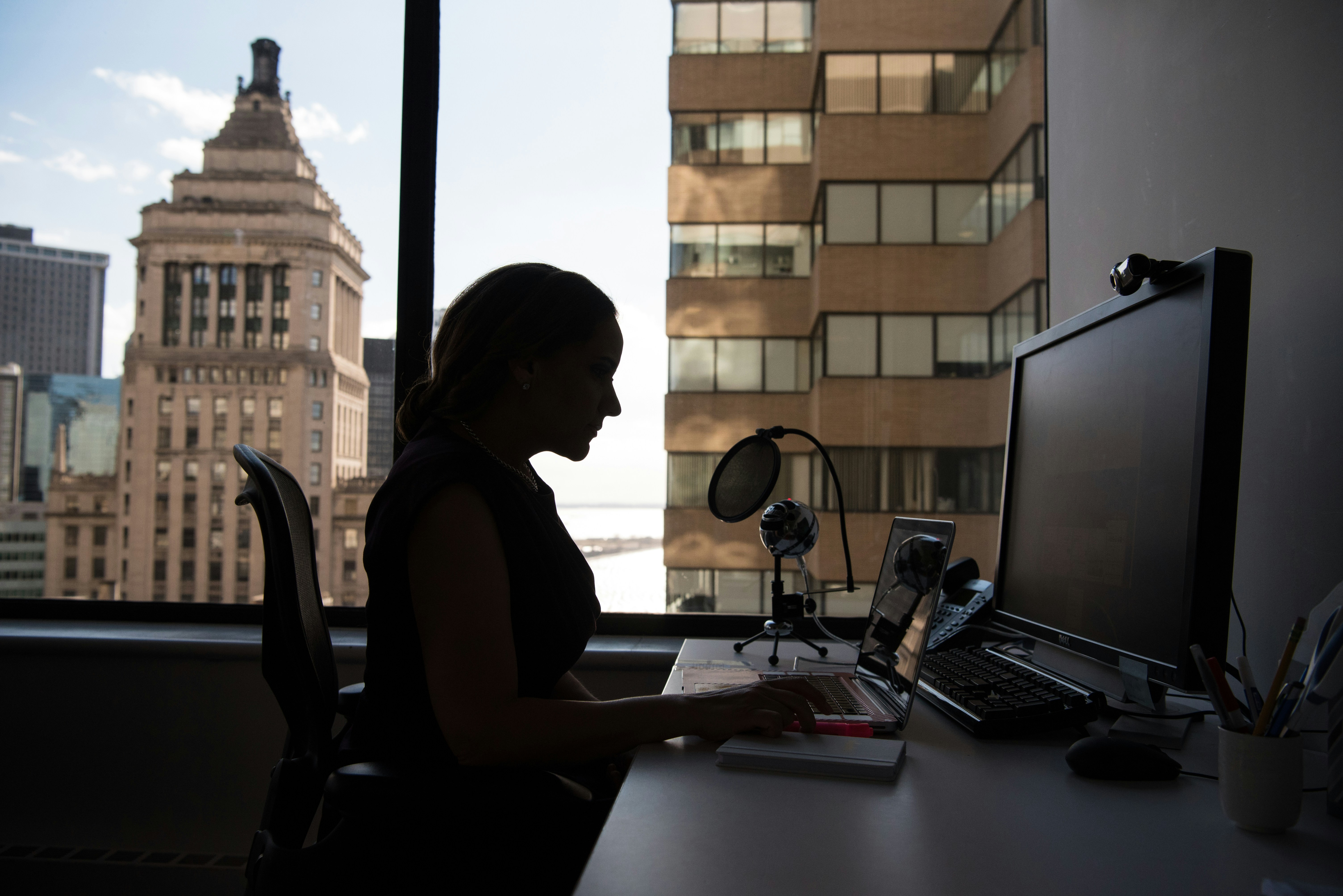 Woman typing on her computer